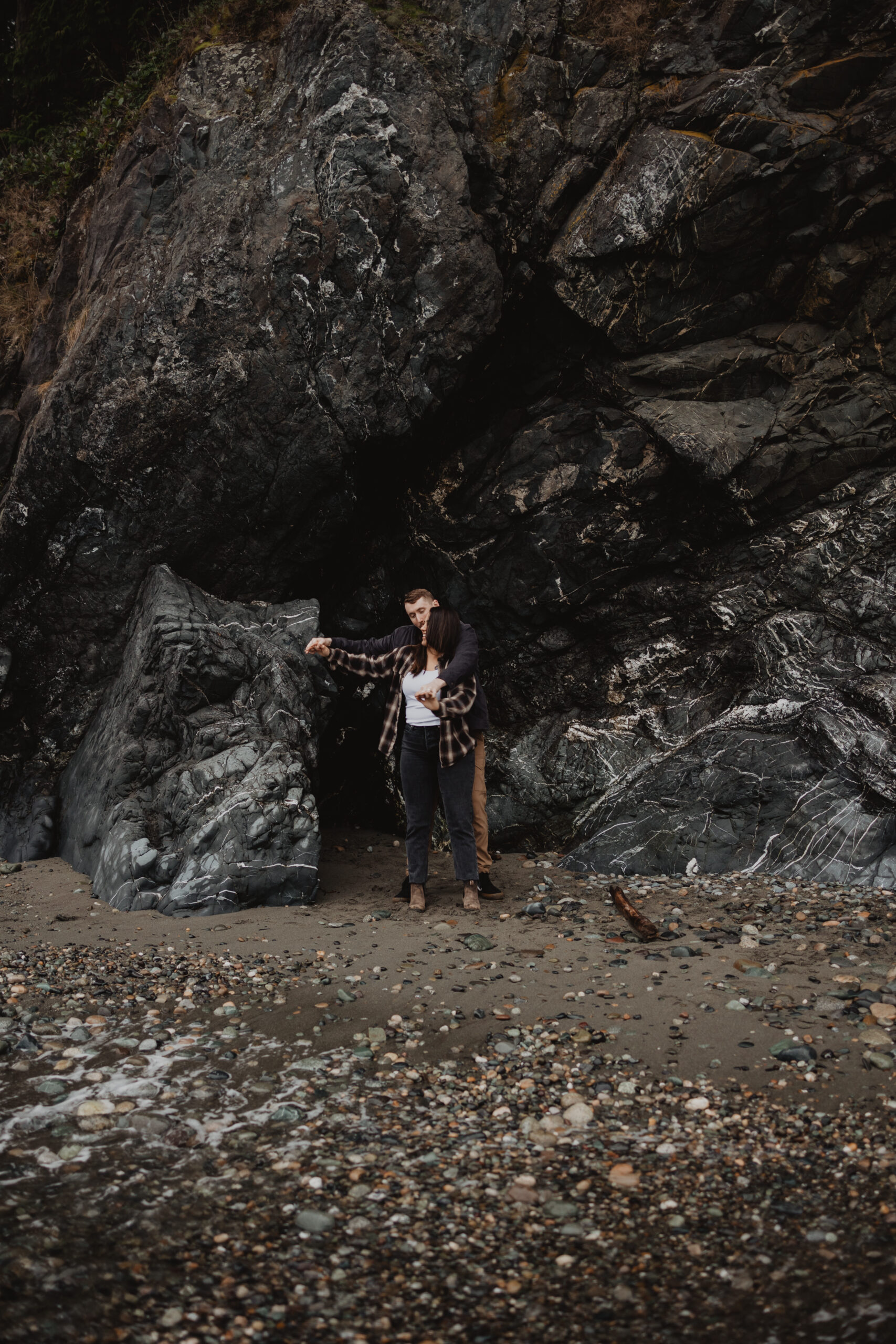a couple posing together for their engagement session at Deception Pass State Park 