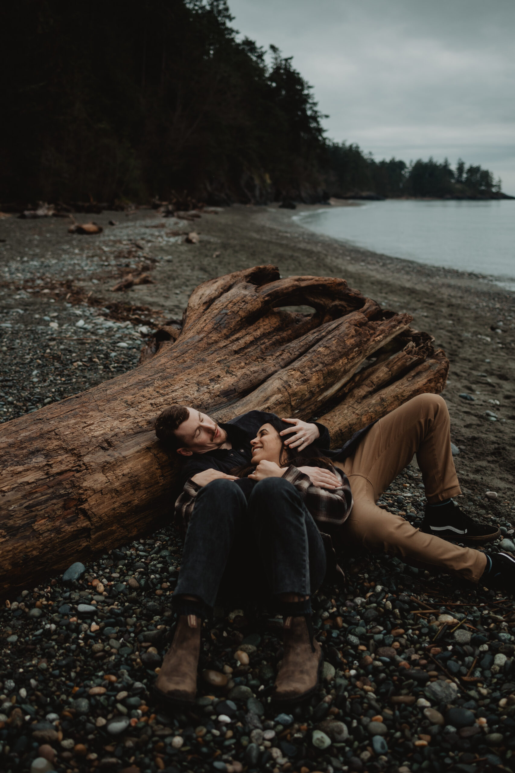 a couple posing together for their engagement session at Deception Pass State Park 